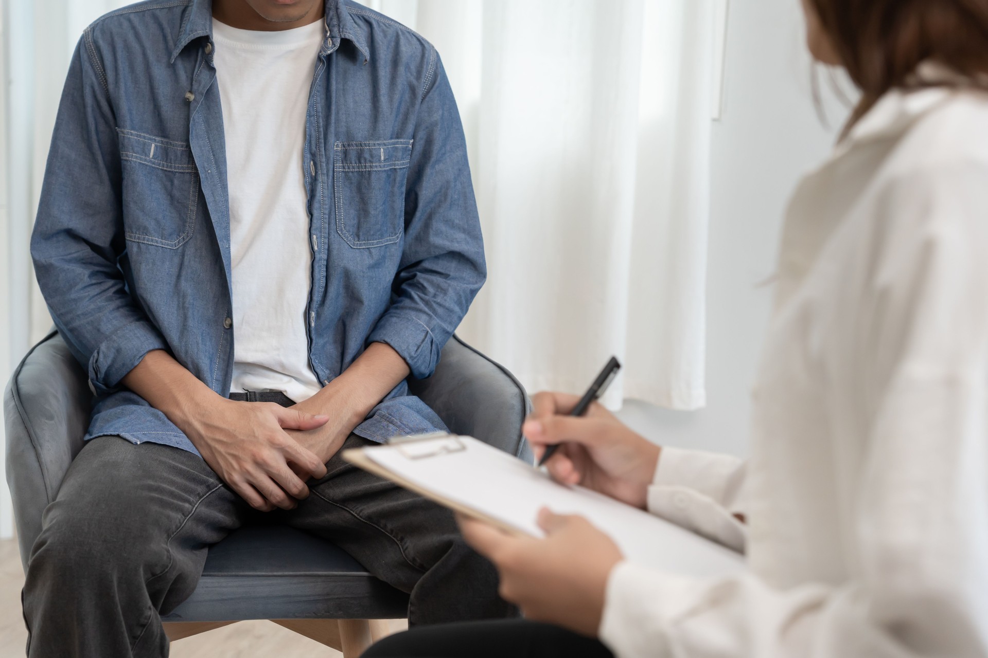 Man hold hand in front of private parts feeling discomfort and consult doctor. Venereal, testicular cancer. bladder problems, erectile dysfunction, premature ejaculation, prostate cancer